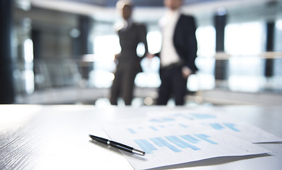 Documents and Blurred Business Men