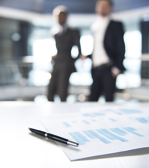 Documents and Blurred Business Men