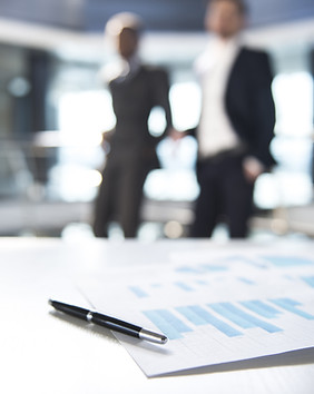 Documents and Blurred Business Men