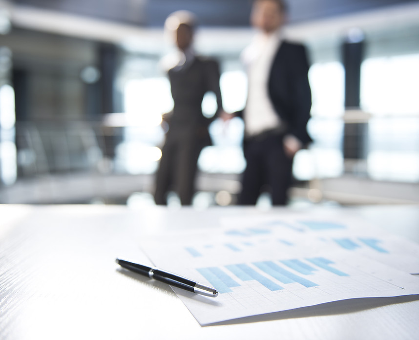 Documents and Blurred Business Men