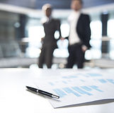 Documents and Blurred Business Men