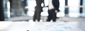 Documents and Blurred Business Men