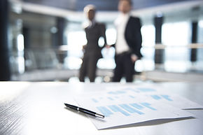 Documents and Blurred Business Men