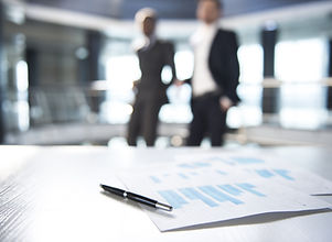 Documents and Blurred Business Men