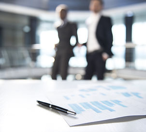 Documents and Blurred Business Men