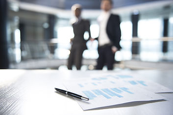 Documents and Blurred Business Men