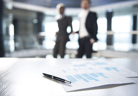 Documents and Blurred Business Men