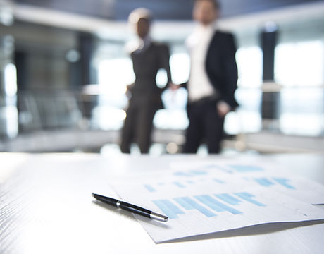 Documents and Blurred Business Men