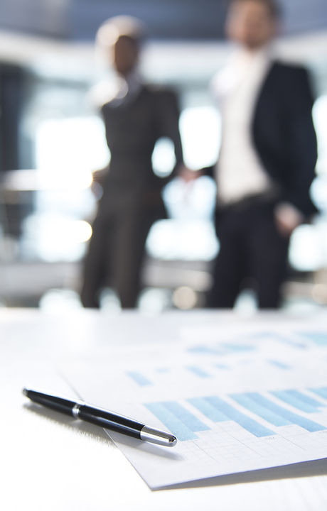 Documents and Blurred Business Men