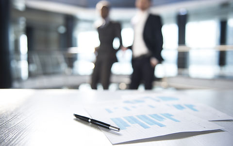 Documents and Blurred Business Men