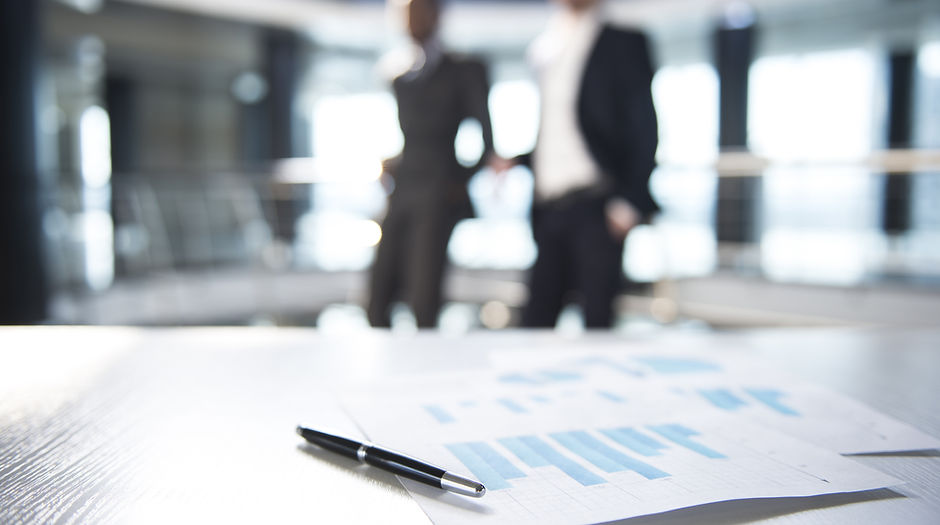 Documents and Blurred Business Men