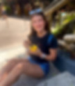 Reilly Cole smiling while enjoying a Dole Whip treat