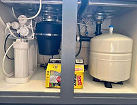 Six-stage alkaline reverse osmosis system installed under a kitchen sink in Scottsdale, Arizona