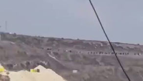 A video depicting settlers converging to begin a raid on a village