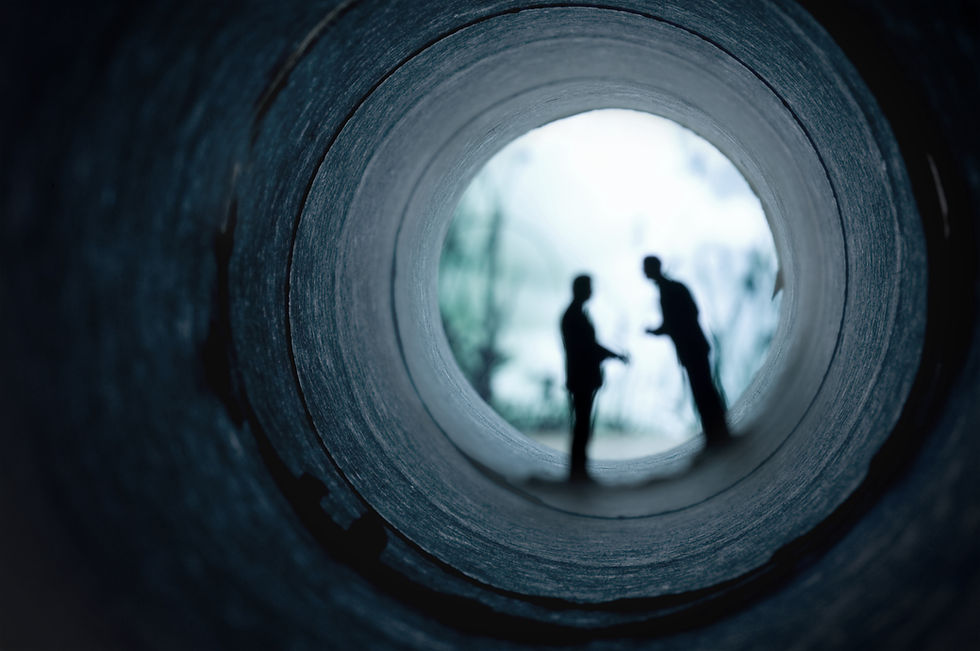 Two shadowy figures meeting at the end of a tunnel