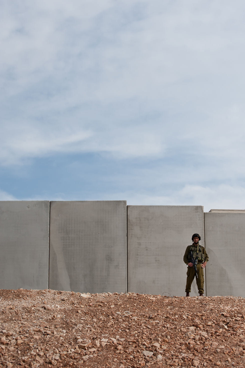 An Israeli soldier standing by the Separation Barrier