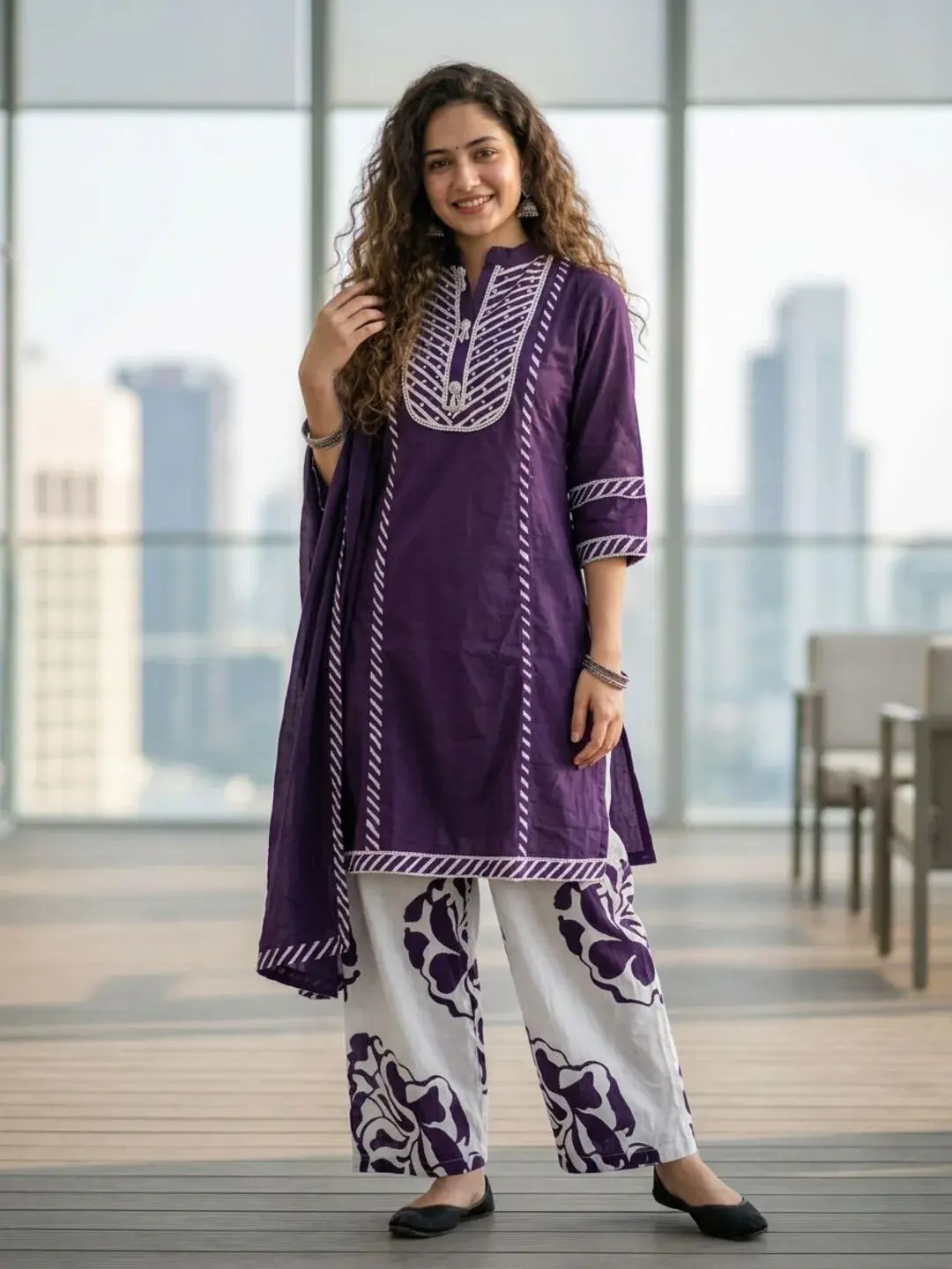 Front view of purple cotton kurta palazzo set for women with mirror work yoke