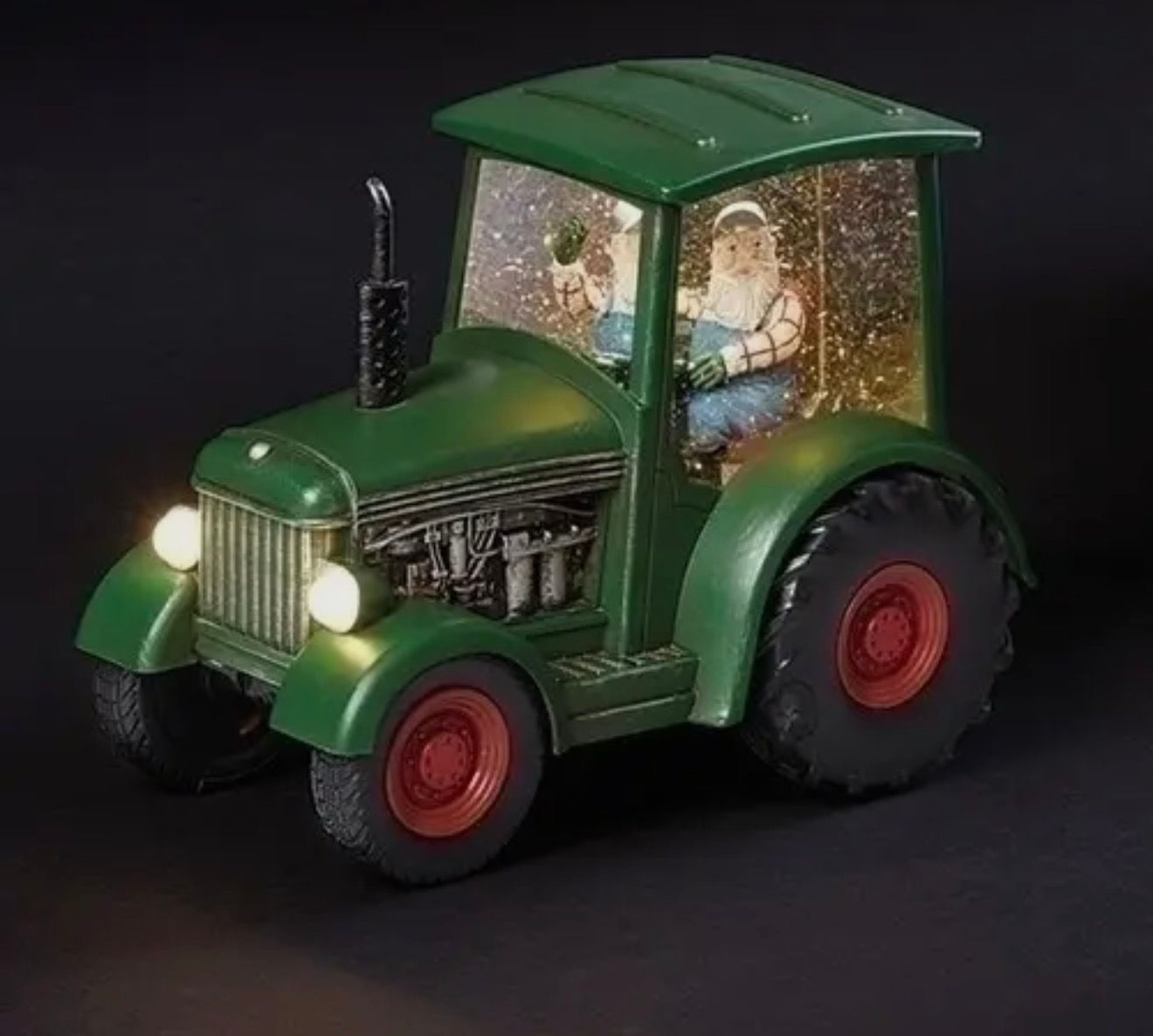 Green tractor snow globe