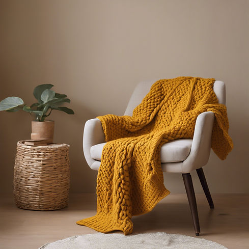a mustard yellow knit blanket on a beige chair.jpg