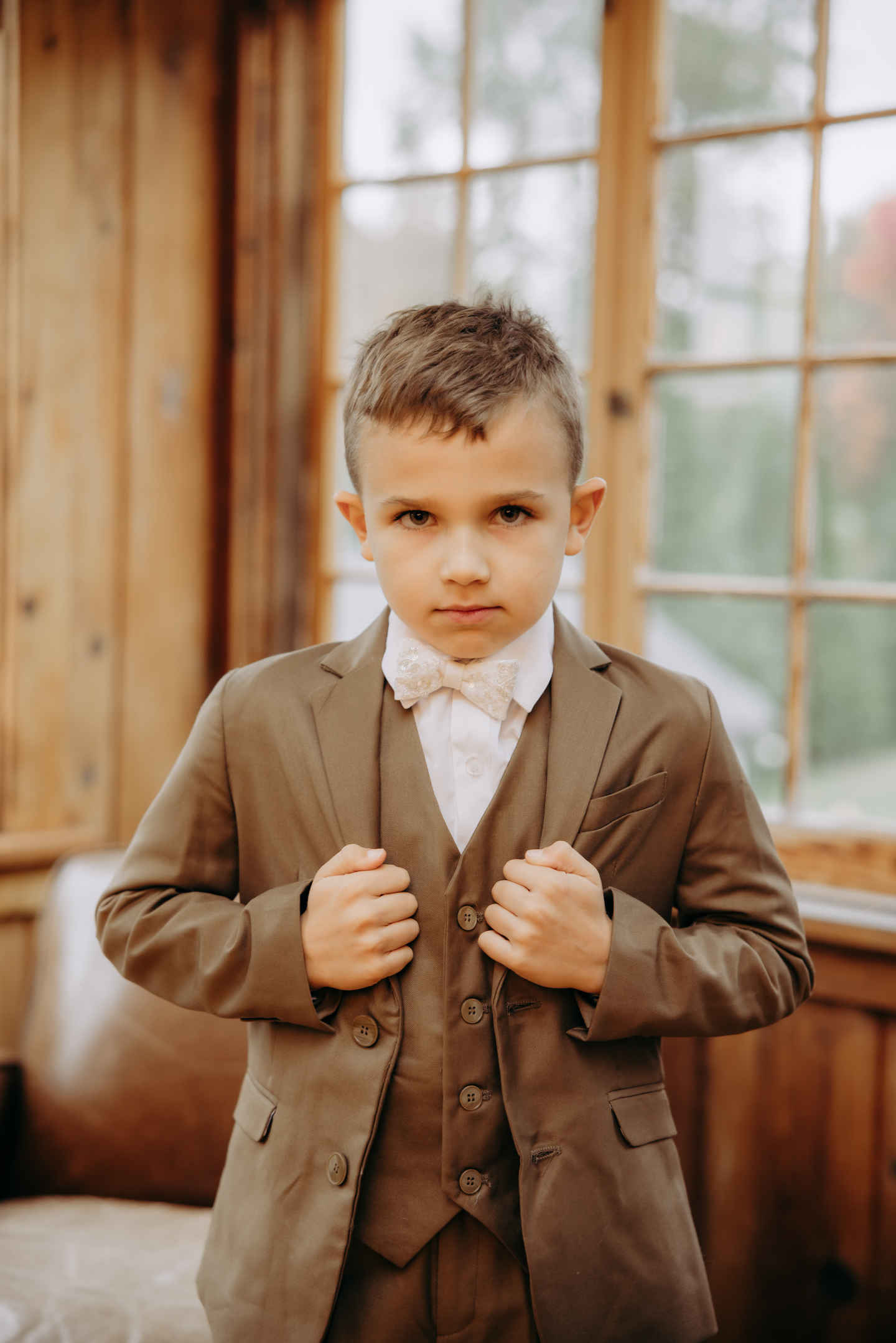 Ringbearer wearing bowtie made from bride's wedding dress