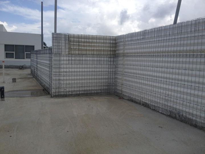 Concrete structures wall, gray, on a gray patio; construction site outdoors CLIENT.