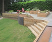 Benefits-of-Wooden-Retaining-Walls-On-The-Back-Yard-Using-Small-Garden-With-Wooden-Bench.j