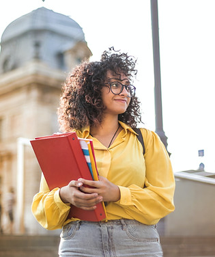 woman-in-yellow-jacket-holding-red-book-