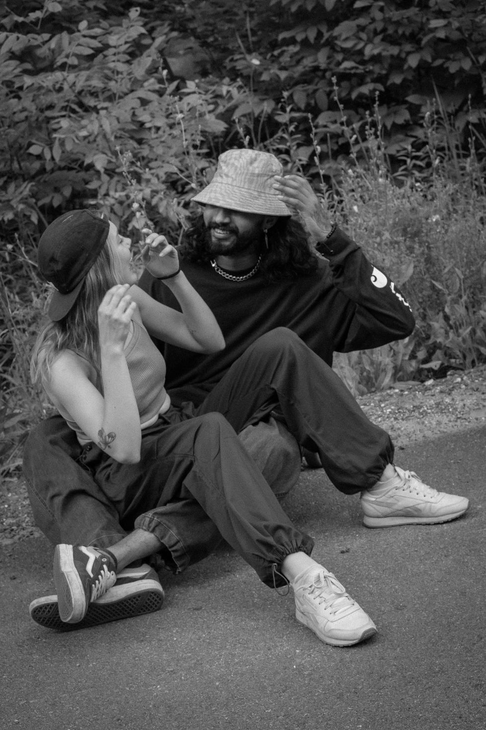 Couple Riding Skateboards on Scenic Street in Gatineau Hills Near Ottawa