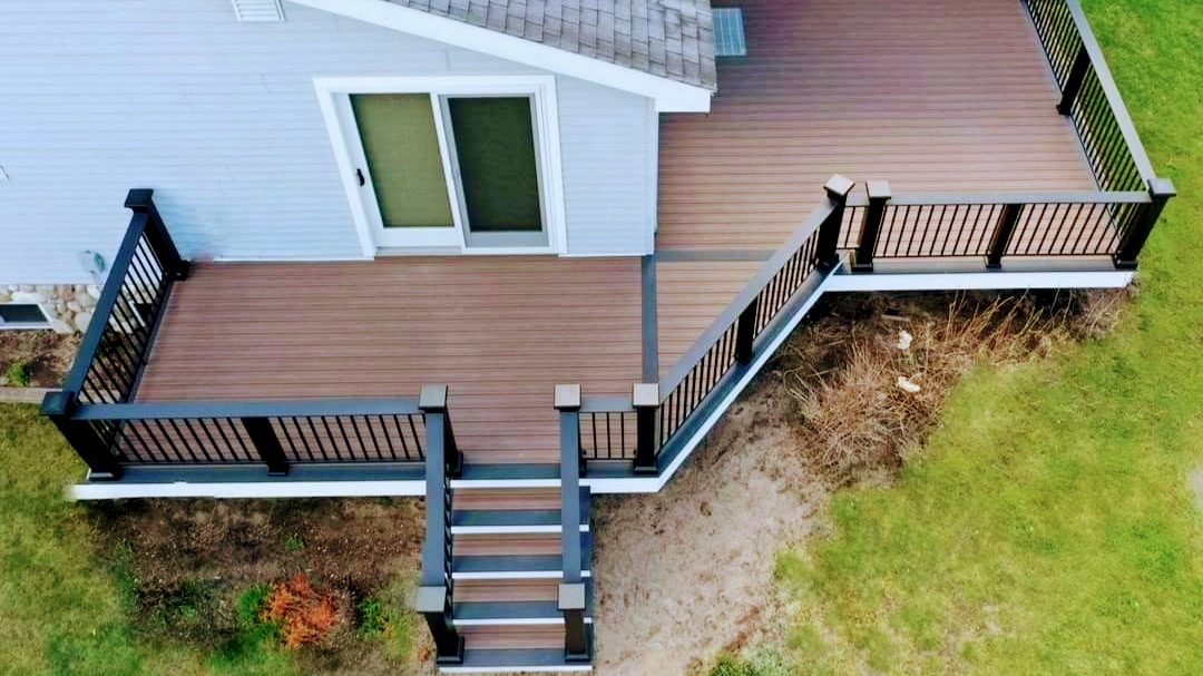 Aerial view of a two-level composite deck built by DeckTacular