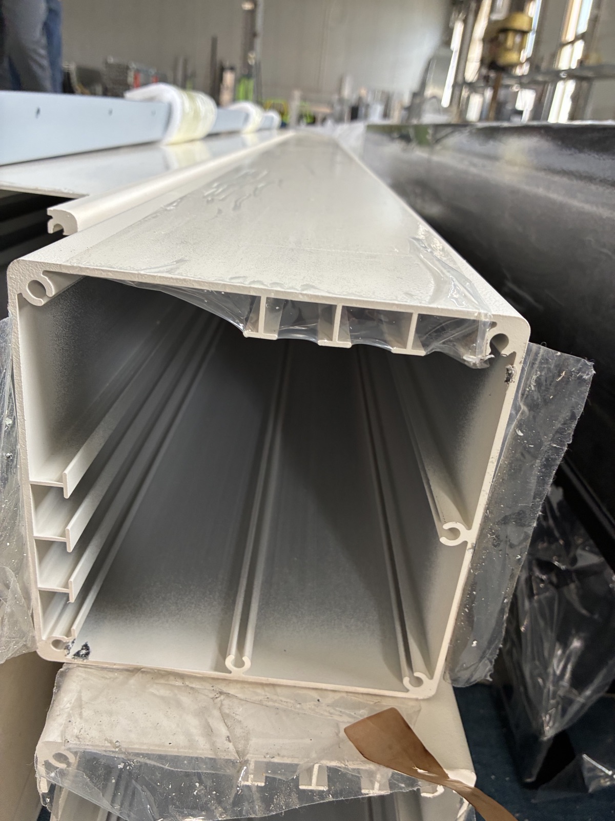 Looking into a cut aluminum post to see its internal ribs