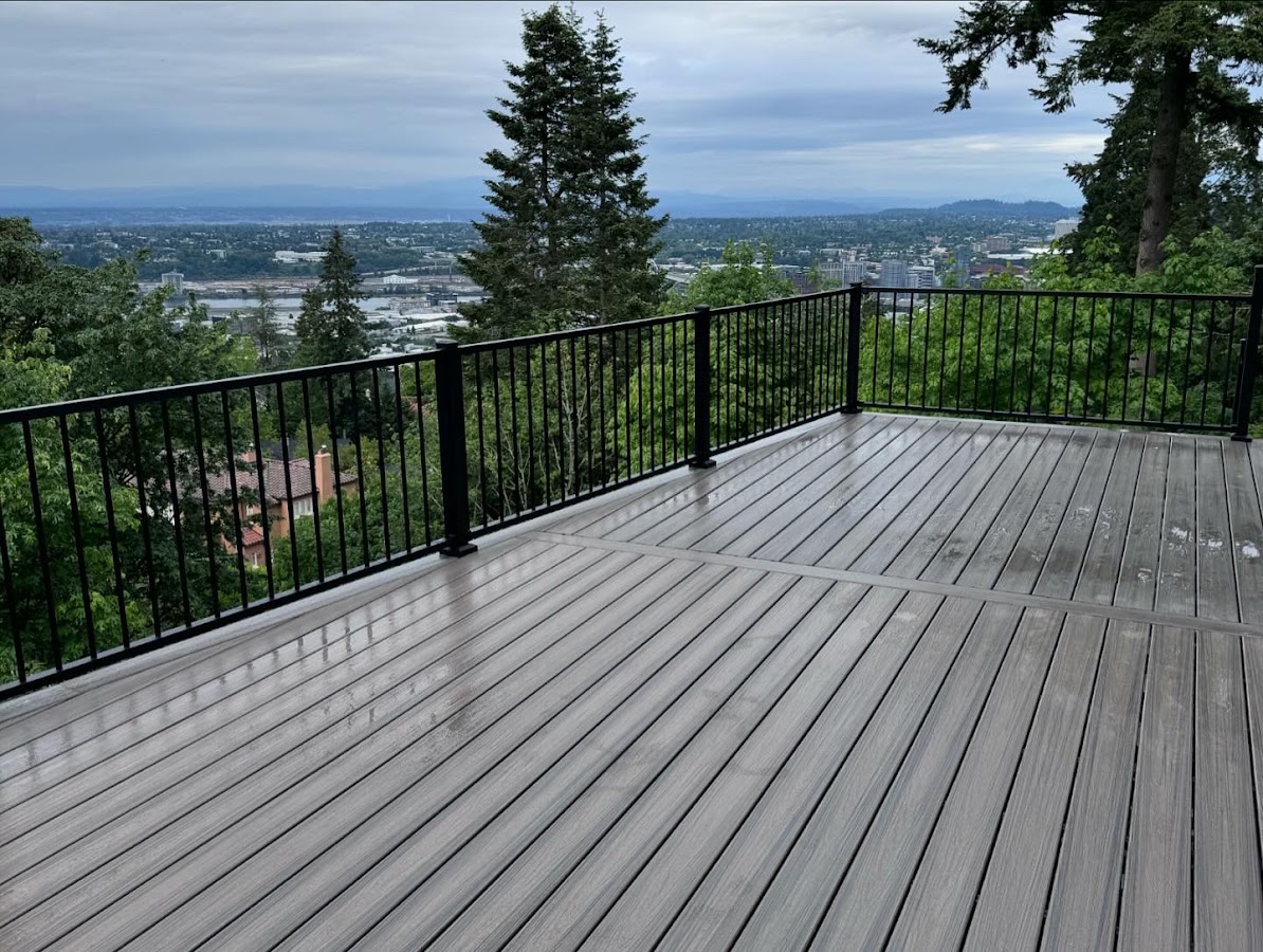 A grey composite deck with black railing built by Next Level Decks and Exteriors