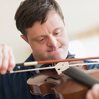 Man with Down Syndrome Playing Violin