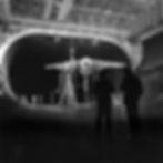 Researchers discussing updates at AMES research facility