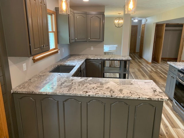 Custom granite kitchen countertops with natural veining installed by AJ Infinity Stone in an Indianapolis home