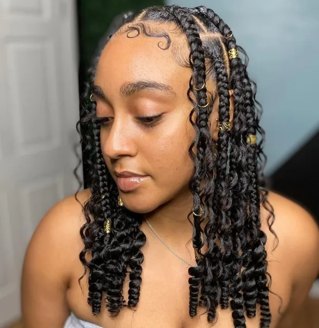 Woman With Curly Knotless Braids with Cuffs