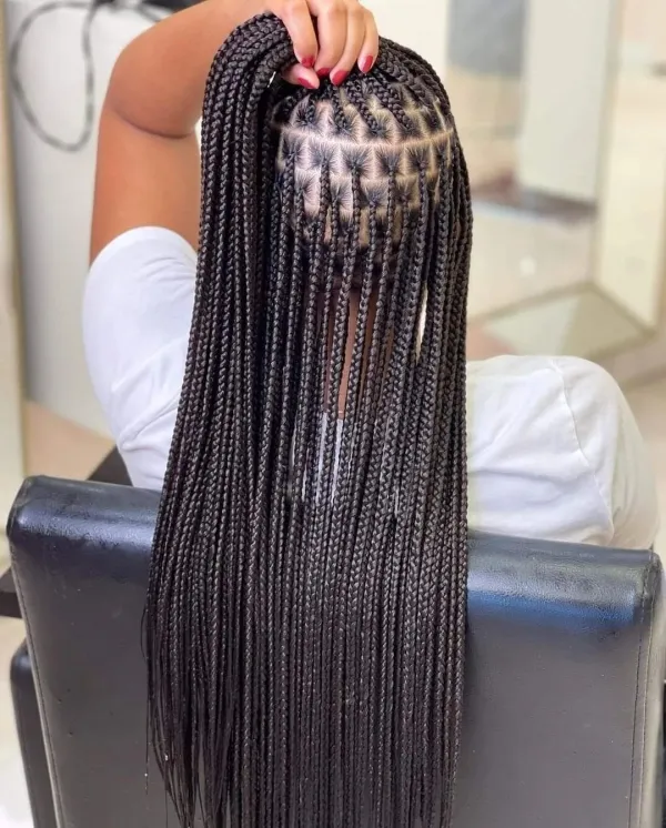 Woman with Long Knotless Braids in Total Black
