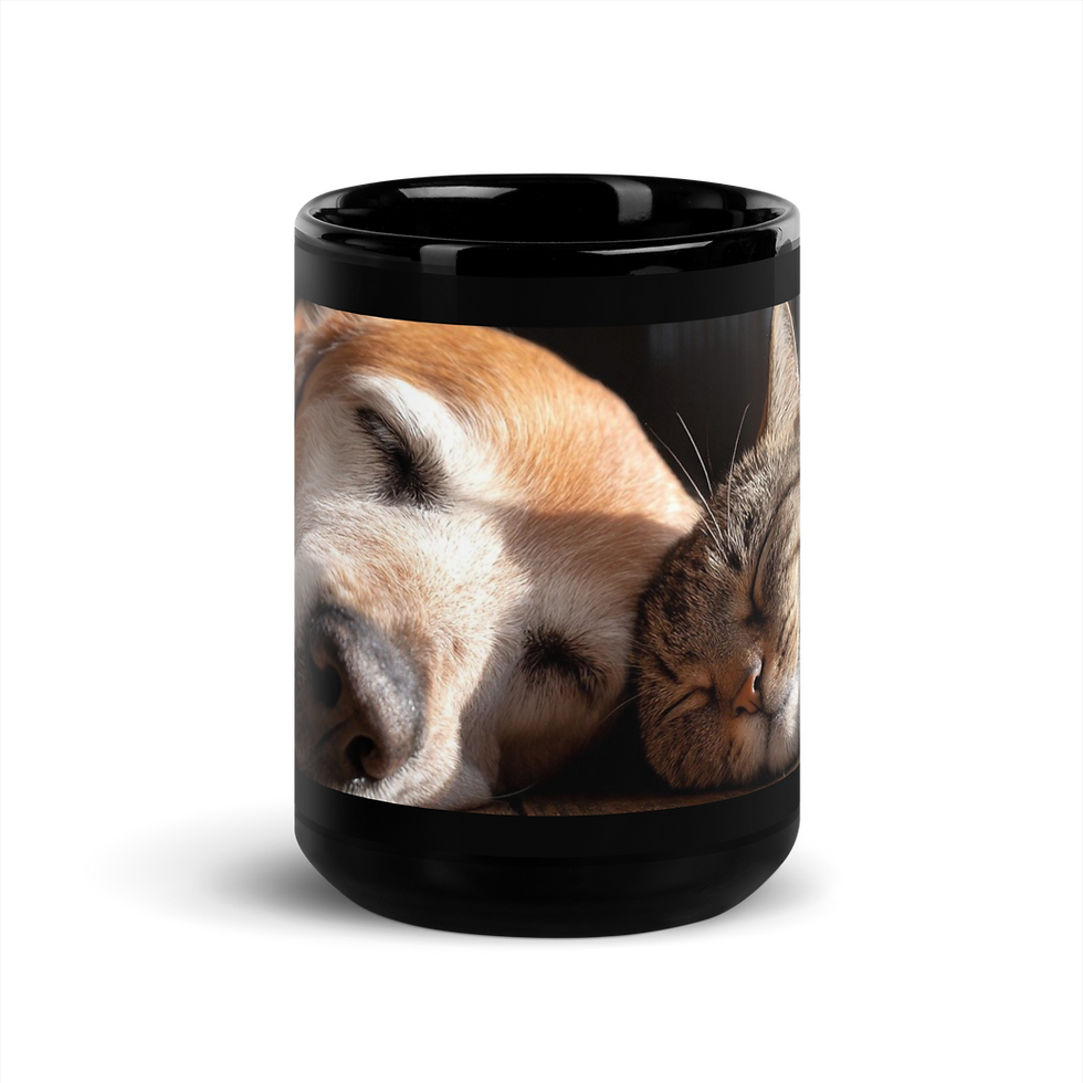Front view of a black ceramic mug featuring a dog and cat snuggled together sleeping