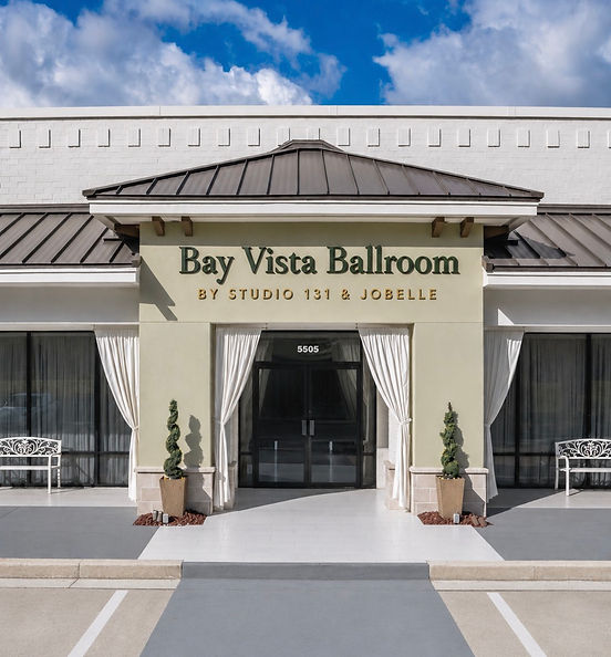 Bay Vista Ballroom entrance with white drapery and florals at 5505 Roosevelt Blvd Clearwater FL wedding venue