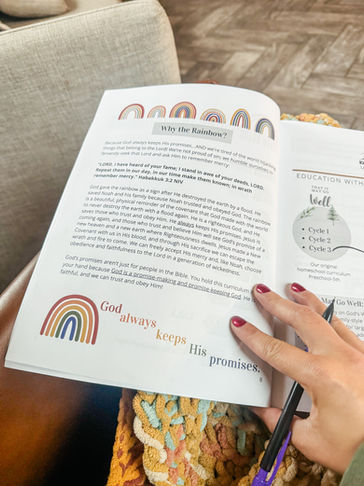 parent plan book for homeschooling opened by mothers hand