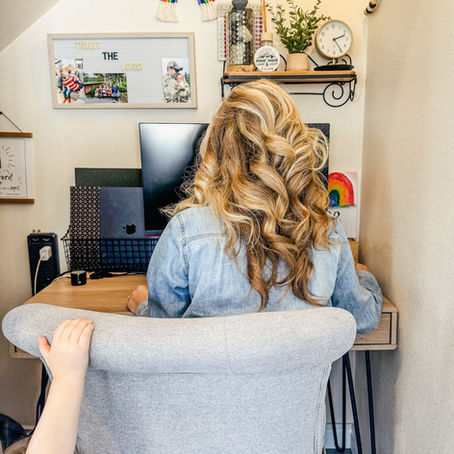 homeschool mom using computer at a desk