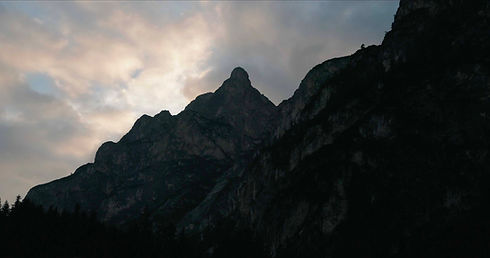 the sun rising over the italian dolomites 
