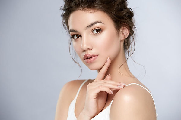 Close-up of laser erbium resurfacing treatment on patient's cheek to reduce wrinkles and scars, showcasing the precision of t