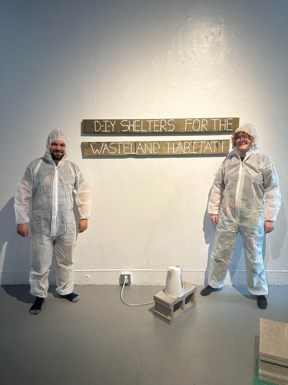 Melanie and Lachlan posing during the exhibition