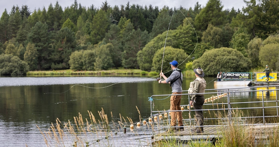 Fisherman casting at the lochside at Moy Country Fair.