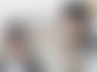 A teacher helps a student who is struggling to read.