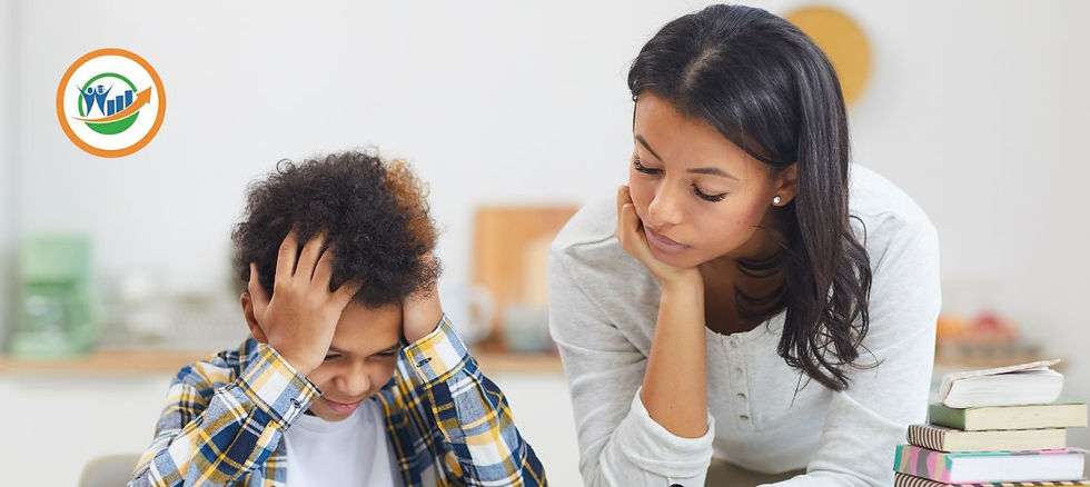 A teacher helps a boy who is struggling to read.