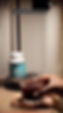 Cherry juice mocktail and Magnesium supplement bottle on a dimly-lit nightstand