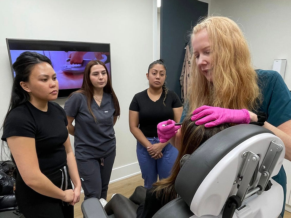 Students learning Botox mapping on a patient