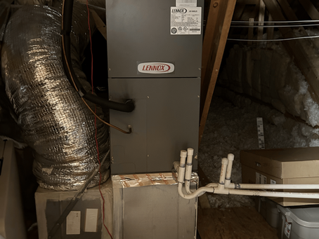 HVAC air handler unit installed in an attic