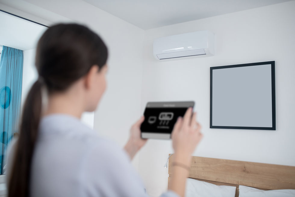 woman turning air conditioner using tablet